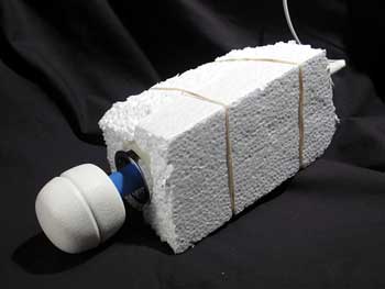 a wand vibrator wrapped in polystyrene to silence it